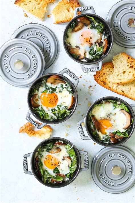 baked-eggs-with-mushrooms-and-spinach-damn-delicious image