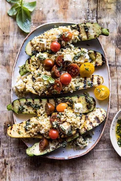 grilled-pesto-zucchini-stuffed-with-tomatoes-and-orzo image