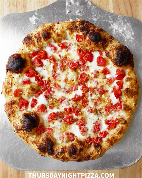 white-pizza-with-roasted-garlic-and-diced-tomatoes image