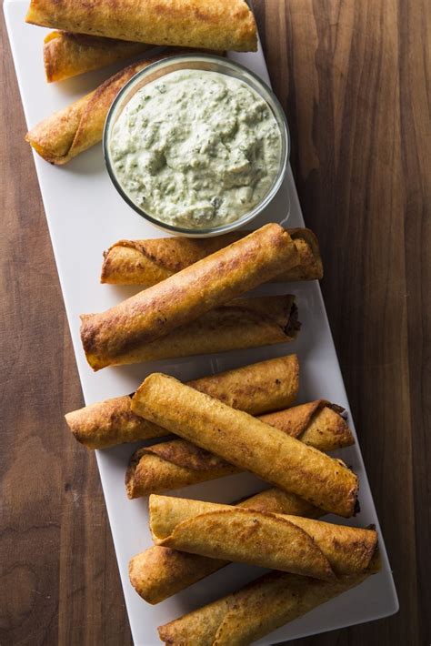 beef-and-bean-taquitos-with-avocado-sauce-a image