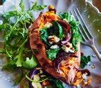baked-sweet-potatoes-with-kale-feta-chilli-and-onion image