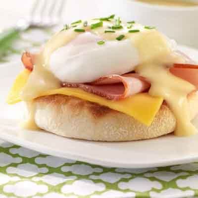 cheesy-eggs-benedict-recipe-land-olakes image
