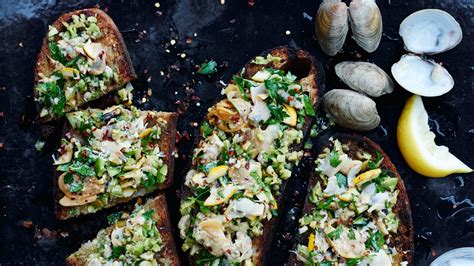 grilled-clam-toasts-with-lemon-and-green-olives image