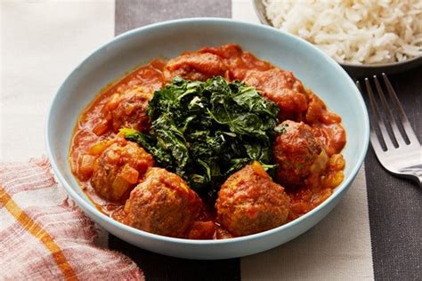 egyptian-meatballs-with-spicy-tomato-sauce-kale-rice image