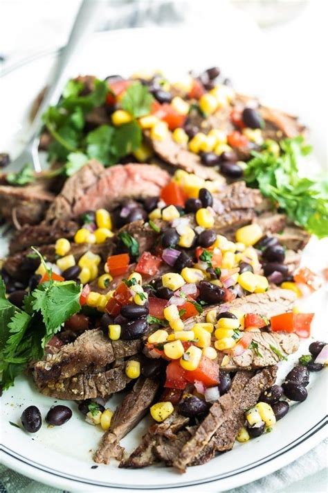 grilled-flank-steak-with-black-beans-corn-and-tomatoes image