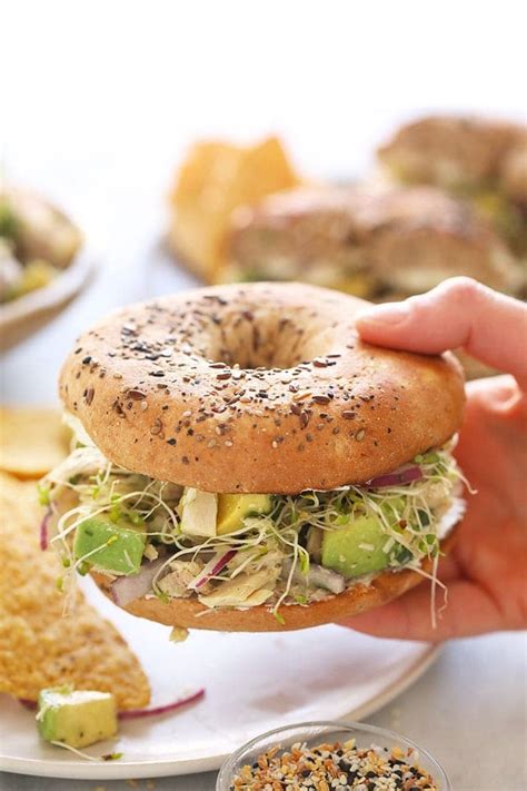 avocado-tuna-salad-sandwich-on-a-bagel-fit image