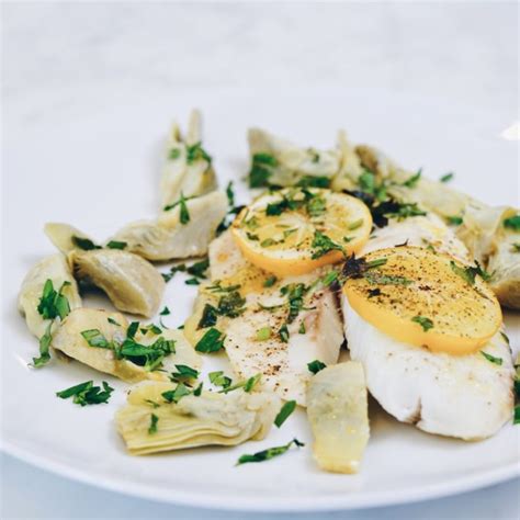 baked-lemon-garlicky-tilapia-with-artichokes-crave image