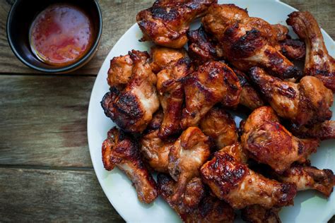 sweet-and-spicy-raspberry-chicken-wings-the-daily-meal image