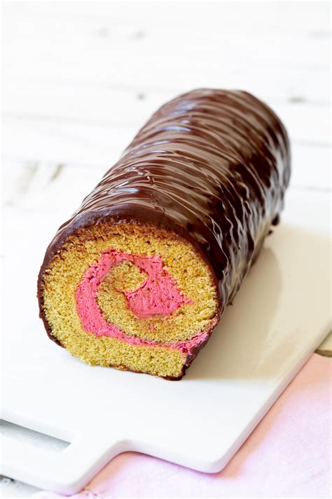 roll-cake-with-raspberry-cake-filling-roulade-a-spicy image