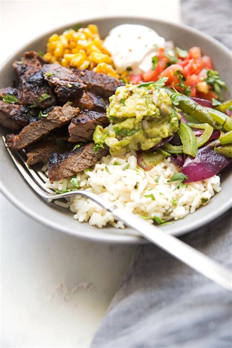 steak-fajita-bowls-with-garlic-lime-rice-recipe-little-spice-jar image