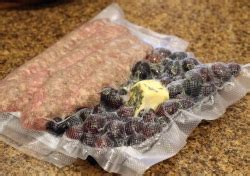 sous-vide-italian-sausages-with-autumn-grapes-and-rosemary image