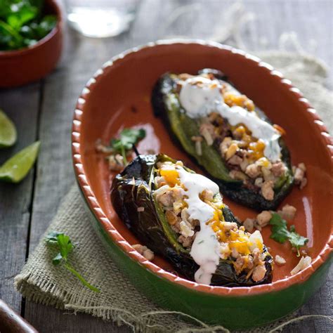 meat-stuffed-poblanos-with-cilantro-lime-sauce image