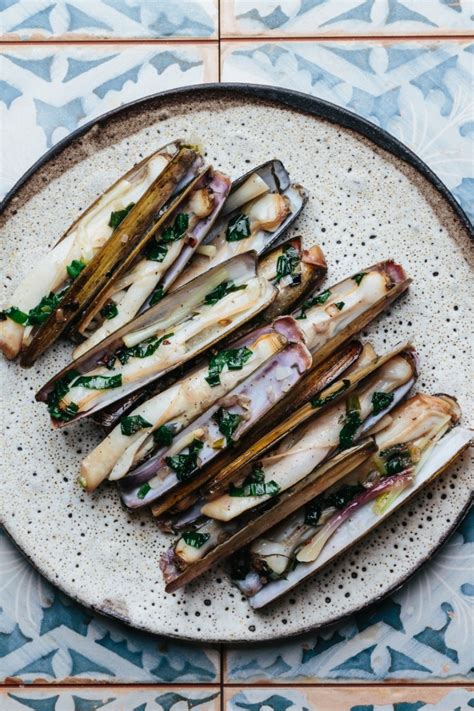 steamed-razor-clams-with-ramps-and-white-wine image
