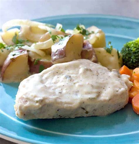 creamy-crock-pot-pork-chops-potatoes-onions image