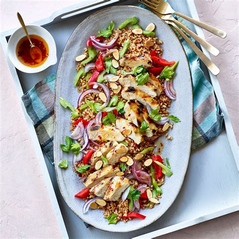 farro-salad-with-grilled-chicken-eatingwell image