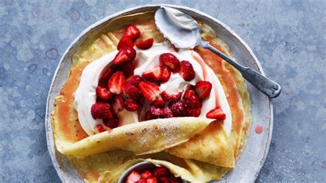 strawberry-and-cream-crepes-recipe-good-food image