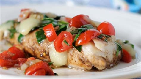 oven-baked-cod-with-tomatoes-and-spinach image