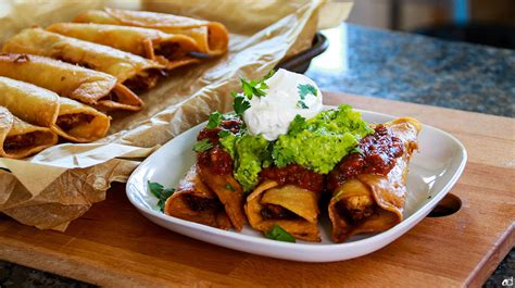 chicken-taquitos-with-chipotle-salsa-and-guacamole image