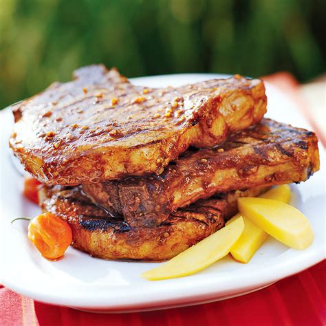 spicy-grilled-pork-chops-recipe-eatingwell image