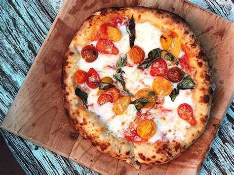 pizza-with-cherry-tomatoes-garlic-basil-mozzarella image