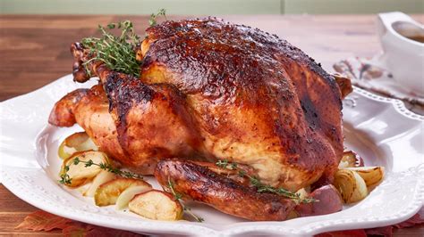 apple-bourbon-turkey-with-maple-syrup-thyme-chicken image