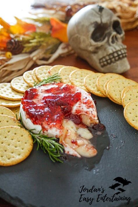 gooey-baked-brie-with-raspberry-preserves-savory image