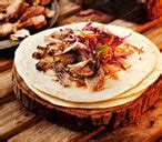 sticky-maple-and-mustard-pulled-pork-wraps-tesco image