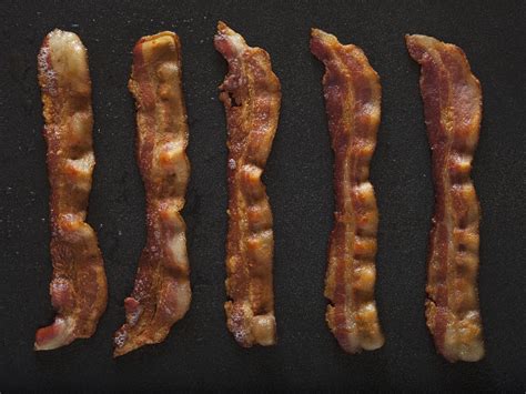homemade-smoked-maple-bacon-recipe-the-spruce image