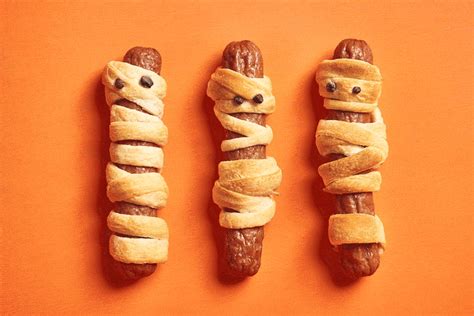 mummy-hot-dogs-recipe-made-with-crescent-rolls image