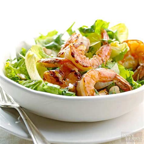 shrimp-on-greens-with-garlic-vinaigrette-better-homes image