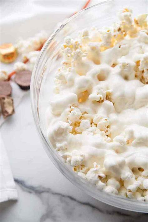 white-chocolate-peanut-butter-cup-popcorn-over-the image