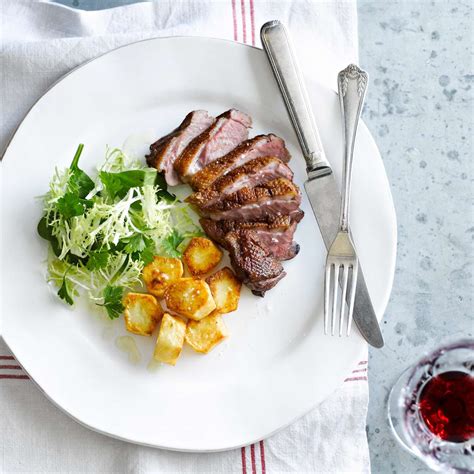 duck-breasts-with-crispy-potatoes-and-frise-salad-food image