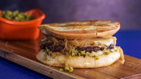 smash-burgers-with-sweet-onions-recipe-rachael-ray image
