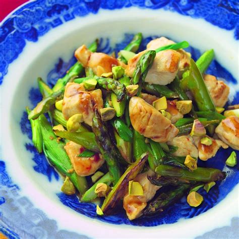wok-seared-chicken-tenders-with-asparagus-pistachios image