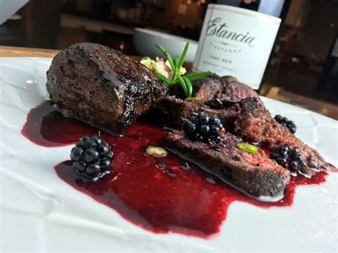 elk-steak-medallions-with-blackberry-red-wine-sauce image