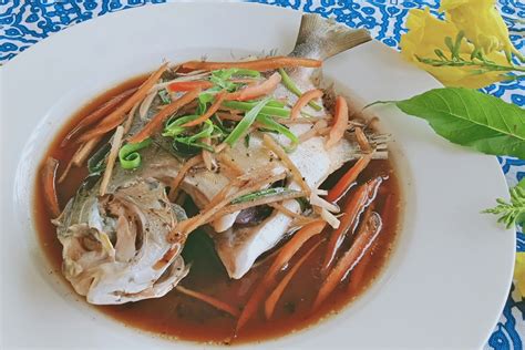 steamed-fish-pompano-with-ginger-soy-and-green image
