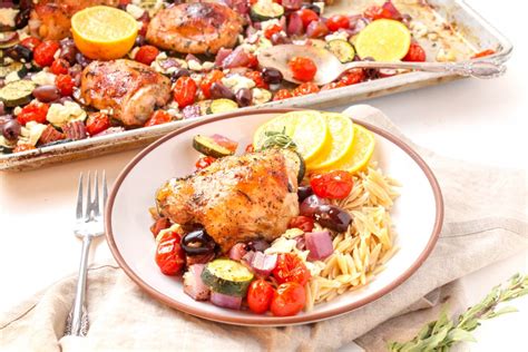 mediterranean-chicken-thighs-with-veggies-sheet-pan image