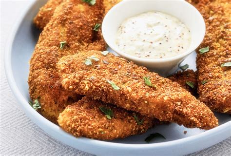 pistachio-and-parmesan-chicken-strips-a-fork-and-a image