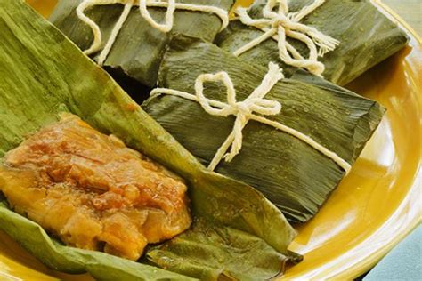 puerto-rican-pasteles-stuffed-plantain-leaves image