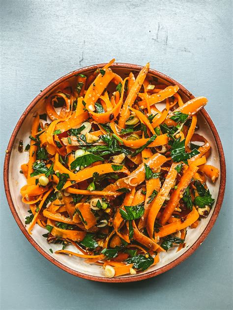 carrot-salad-with-green-onions-parsley-hazelnuts image