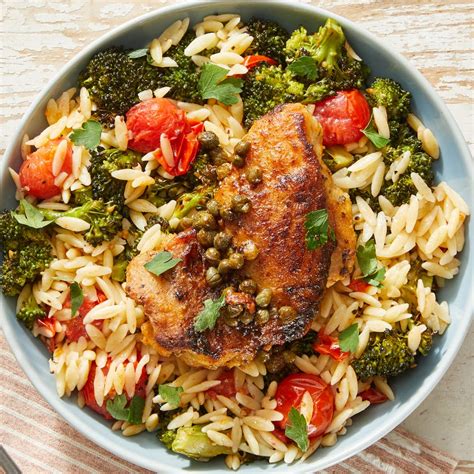 lemon-caper-chicken-with-creamy-roasted-vegetable-orzo image