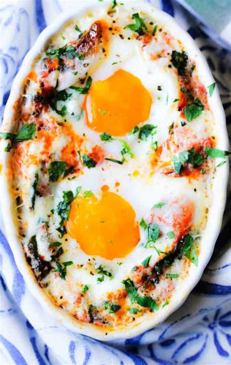 baked-eggs-in-tomato-spinach-cream-sauce-eating-european image
