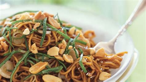 spicy-sesame-noodles-with-chopped-peanuts-and-thai-basil image