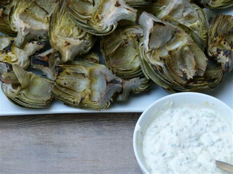 grilled-artichokes-with-lemon-caper-dipping-sauce image
