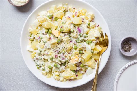 potato-salad-recipe-with-eggs-and-peas-the-spruce-eats image
