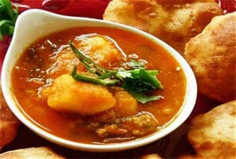aloo-ki-sabji-with-puri-poori-potato-curry-indian image