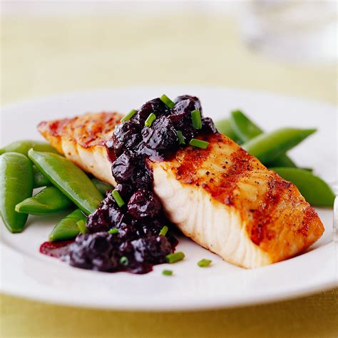 grilled-salmon-with-blueberry-sauce-eatingwell image