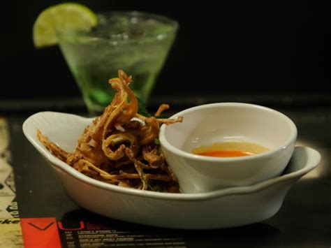 fried-pig-ears-with-hot-sauce-recipe-cooking-channel image