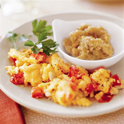 scrambled-eggs-with-tomatoes-and-peppers-eatingwell image