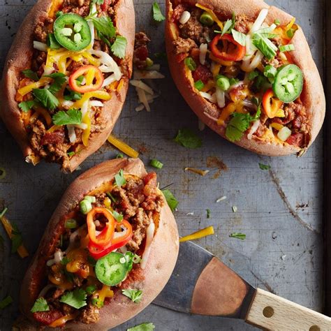 chili-topped-sweet-potatoes-recipe-eatingwell image